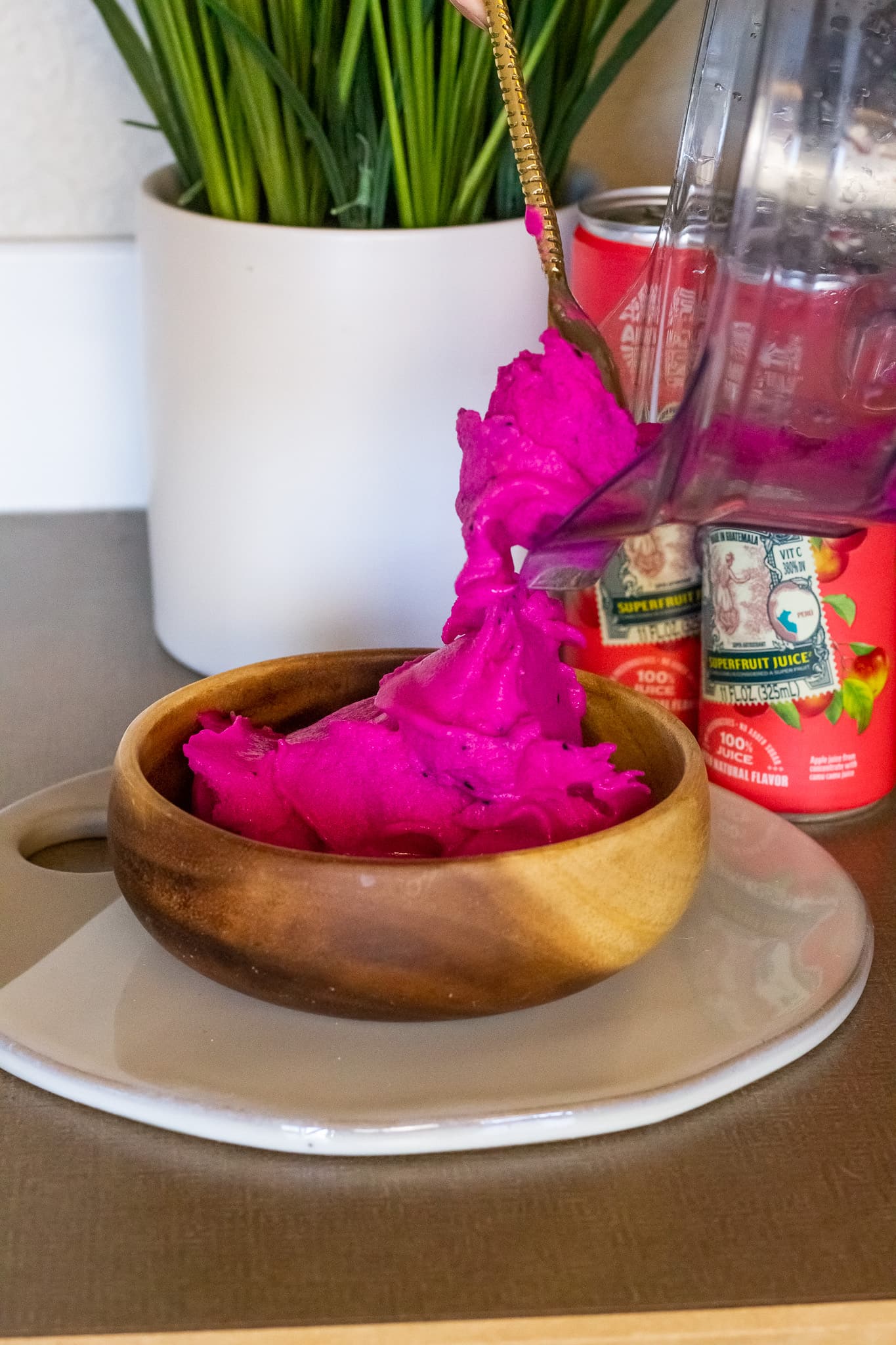 Mixture being poured into a smoothie bowl